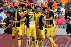 Atletico Madrid's players celebrate after they scored against Valencia during their Spanish first division soccer match in Valencia