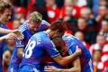 Chelsea's Ba celebrates with teammates after scoring a goal during their English Premier League soccer match against Liverpool at Anfield in Liverpool