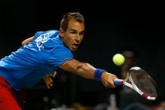 Czech Republic's Rosol returns shot against Japan's Daniel during Davis Cup quarter final tennis match in Tokyo
