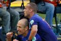 Robben and Sneijder of the Netherlands celebrate after scoring against Australia during their 2014 World Cup Group B soccer match at the Beira Rio stadium in Porto Alegre