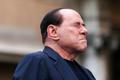 File photo of Berlusconi closing his eyes in a gesture to supporters during a rally to protest his tax fraud conviction, outside his palace in central Rome