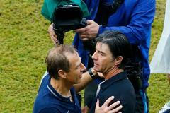 U.S. coach Klinsmann hugs Germany's coach Loew after their teams' 2014 World Cup Group G soccer match in Recife