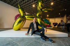 Artist Jeff Koons poses during a press preview before the opening of his retrospective at the Whitney Museum of American Art in New York