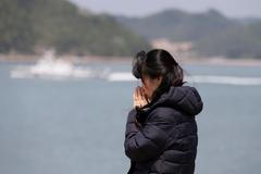 Příbuzná pohřešovaných z potopeného trajektu.