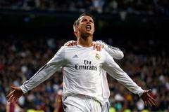 Real Madrid's Ronaldo and Ramos celebrate a goal against Barcelona during La Liga's second 'Clasico' soccer match of the season in Madrid