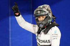 Mercedes Formula One driver Nico Rosberg of Germany celebrates after taking pole position at the qualifying session of the Bahrain F1 Grand Prix at the Bahrain International Circuit (BIC) in Sakhir