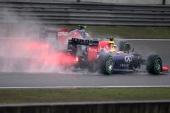 Red Bull Racing Formula One driver Ricciardo of Australia and Toro Rosso Formula One driver Kvyat of Russia drive during the third practice session of the Chinese F1 Grand Prix at the Shanghai Interna
