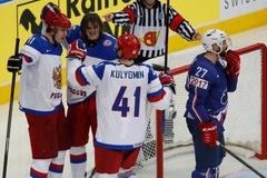 Russia's Malkin celebrates goal as France's Amar reacts in men's ice hockey World Championship quarter-final game in Minsk
