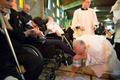 Pope Francis kisses the foot of a disabled person at the S. Maria della Provvidenza church in Rome, during Holy Thursday celebration