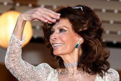 Actress Sophia Loren poses on the red carpet as she arrives for the screening of the film "Deux jours, une nuit" at the 67th Cannes Film Festival in Cannes