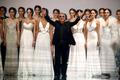 File photo shows Italian designer Roberto Cavalli acknowledging the crowd after models presented his collection during the Cali Exposhow in Cali