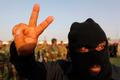 A Mehdi Army fighter loyal to Shi'ite cleric Moqtada al-Sadr gestures during military-style training in Najaf