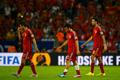 Spain's Koke, Cazorla and Busquets walk off the pitch at the end of their 2014 World Cup Group B soccer match against Chile in Rio de Janeiro