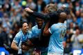 Manchester City's manager Manuel Pellegrini is lifted by his players as they celebrate winning the English Premier League trophy following their soccer match against West Ham United