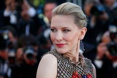 Actress Cate Blanchett poses on the red carpet as she arrives for the screening of the film "How to Train Your Dragon 2" out of competition at the 67th Cannes Film Festival in Cannes