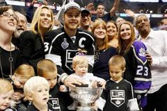 Los Angeles Kings' Dustin Brown puts daughter Mackenzie in the Stanley Cup after NHL Stanley Cup Finals in Los Angeles