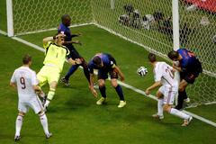 Stefan de Vrij of the Netherlands scores against Spain during their 2014 World Cup Group B soccer match at the Fonte Nova arena in Salvador
