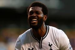 Tottenham Hotspur's Adebayor reacts after missing a chance to score against Arsenal during their English Premier League soccer match in London