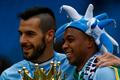 Manchester City's Alvaro Negredo and team mate Fernandinho celebrate after winning the English Premier League trophy