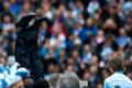 Manchester City's manager Manuel Pellegrini is thrown into the air by his team as they celebrate winning the English Premier League trophy following their soccer match against West Ham United
