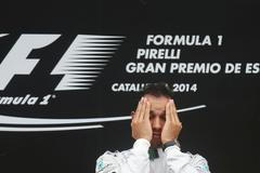 First placed Mercedes Formula One driver Hamilton of Britain reacts on podium after the Spanish F1 Grand Prix at the Barcelona-Catalunya Circuit in Montmelo