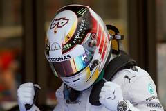 Mercedes Formula One driver Lewis Hamilton celebrates after taking the pole position at the qualifying session of the Spanish F1 Grand Prix at the Barcelona-Catalunya Circuit in Montmelo