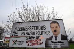 A defaced election poster of far-right Jobbik party leader Gabor Vona is seen in Budapest