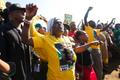 Supporters of African National Congress greet South African President Jacob Zuma after he voted at a voting station in the Nkandla district