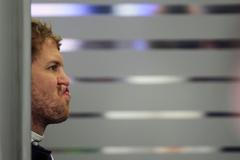 Red Bull Formula One driver Sebastian Vettel of Germany reacts during the first practice session of the Bahrain F1 Grand Prix at the Bahrain International Circuit (BIC) in Sakhir