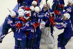 France's players celebrate after their men's ice hockey World Championship Group A game against Canada at Chizhovka Arena in Minsk