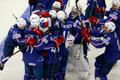 France's players celebrate after their men's ice hockey World Championship Group A game against Canada at Chizhovka Arena in Minsk
