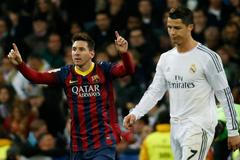 Barcelona's Lionel Messi celebrates a goal next to Real Madrid's Cristiano Ronaldo during La Liga's second 'Clasico' soccer match of the season in Madrid