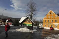 zadlužený Harrachov