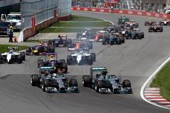 Mercedes Formula One driver Rosberg of Germany and Mercedes Formula One driver Hamilton of Britain lead the pack at the start during the Canadian F1 Grand Prix at the Circuit Gilles Villeneuve in Mont