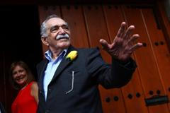 Gabriel Garcia Marquez greets journalists and neighbours on his birthday outside his house in Mexico City