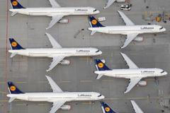 File aerial photo shows Lufthansa planes parked on the tarmac of the closed Frankfurt's airport