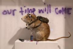 A rat forms part of work entitled "Banksus Militus Vandalus" installation at Banksy: The Unauthorised Retrospective exhibition at Sotheby's S2 Gallery in London