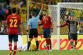 Referee Kuipers shows Spain's Pique the red card after he fo
