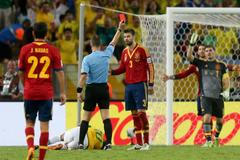 Referee Kuipers shows Spain's Pique the red card after he fo