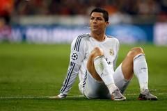 Real Madrid's Ronaldo spits out as he sits in the pitch during their Champions League quarter-final first leg soccer match against Borussia Dortmund in Madrid