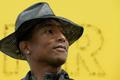 Singer Pharrell Williams poses during the opening of the exhibition "GIRL" at the Galerie Perrotin in Paris