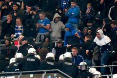 German riot police enters Hamburg SV supporters' block during break of their German Bundesliga first division soccer match against Bayern Munich in Hamburg