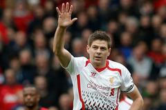 Liverpool's Gerrard celebrates scoring a penalty against Manchester United during their English Premier League soccer match in Manchester