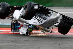 Williams Formula One driver Massa of Brazil crashes with his car in the first corner after the start of the German F1 Grand Prix at the Hockenheim racing circuit