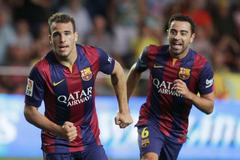 Barcelona's Sandro celebrates next to team mate Xavi after he scored against Villarreal during their Spanish first division soccer match at the Madrigal stadium in Villarreal