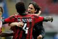 AC Milan's Muntari celebrates with his coach Inzaghi after scoring goal against Lazio  during their Italian Serie A match in Milan