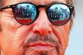 Members of the media are reflected in the sunglasses of cast member Al Pacino as he attends the red carpet for the movie "Manglehorn" at the Venice Film Festival