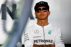 Mercedes Formula One driver Hamilton waits during the first free practice session ahead of the German F1 Grand Prix at the Hockenheim racing circuit