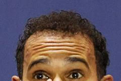 Mercedes Formula One driver Lewis Hamilton of Britain reacts after winning the Bahrain F1 Grand Prix at the Bahrain International Circuit (BIC) in Sakhir