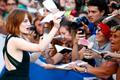 U.S. actress Stone signs autographs during the red carpet for the movie "Birdman or (The unexpected virtue of ignorance)" at the 71st Venice Film Festival